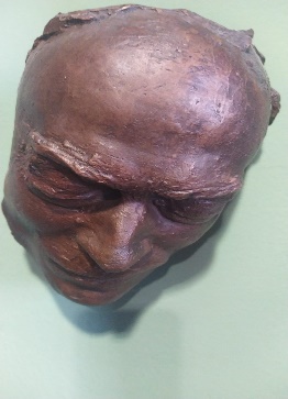 Maschera funeraria in bronzo
